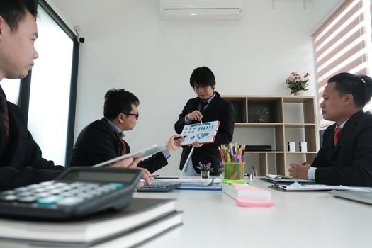 business people having a meeting. businessman working with financial plan report. startup man discussing idea at workplace. teamwork, corporate concept.