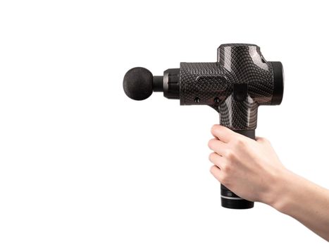 Close-up of a female hand with a portable massager gun on a white background.