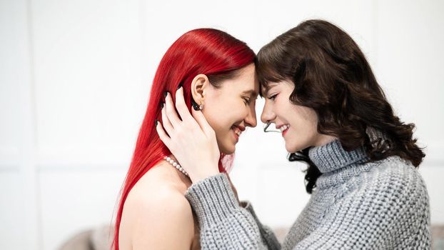 Young Caucasian women hugging tenderly. Same-sex relationships.