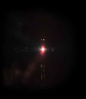 Red light Lens flare on black background.