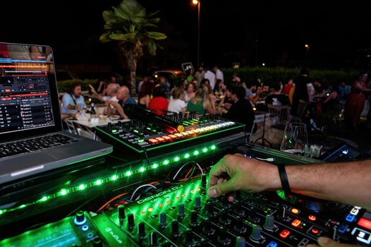 console with DJ during a disco party