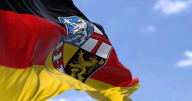 The flag of Saarland waving in the wind on a clear day
