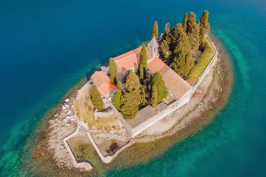 Aerophotography. View from flying drone. St George Island in the Bay of Kotor at Perast in Montenegro, with St George Benedictine Monastery. St. George Island, is a small natural island off the coast of Perast in Bay of Kotor, Montenegro