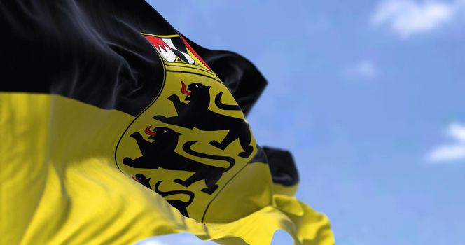The flag of Baden-Württemberg waving in the wind on a clear day