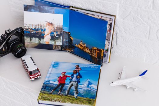 Photobook Album with Travel Photo with toy bus and plane. photo book