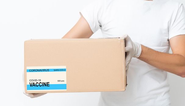 the man delivers the vaccine. Placing VACCINE label on the cardboard box