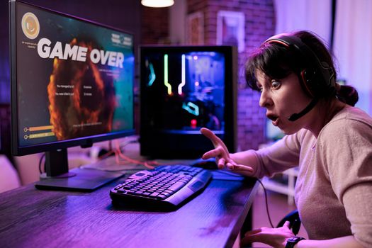Frustrated woman losing video games tournament on pc