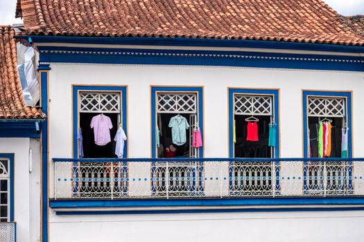 Colorful clothes in the windows of a historic building