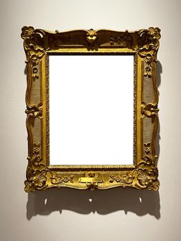 Antique golden art fair gallery frame on the wall at auction house or museum exhibition, blank template with empty white copyspace for mockup design, artwork