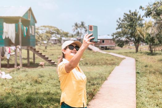 Latin woman taking a selfie in an Afro-descendant indigenous community in Nicaragua