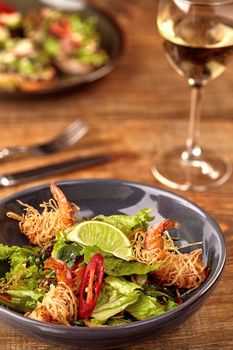 Prawn salad with lettuce and lime.