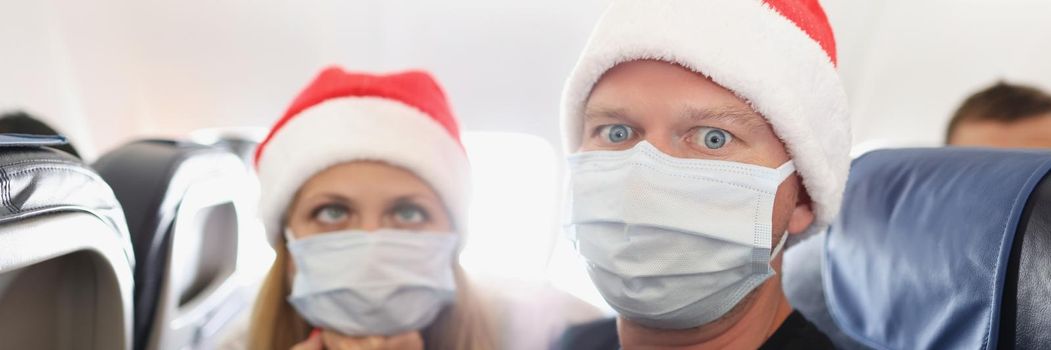 Couple tired of strong restrictions and need to wear face mask on board