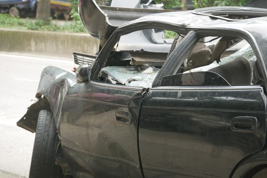 black car damaged by a road accident