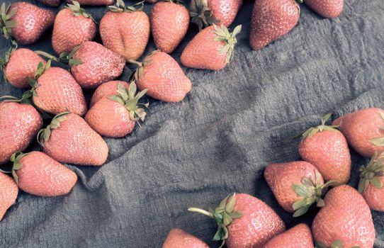 Ripe strawberries on the table on a napkin