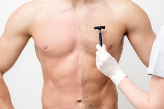Beautician shaves chest of young man