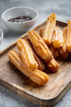 Churros with chocolate Traditional Spanish cusine, on gray background