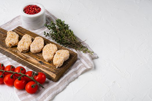 Chicken nuggets uncooked set, on white stone table background, with copy space for text