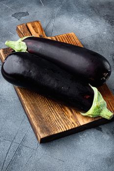 Eggplant, aubergine organic ripe whole vegetables, on gray stone background