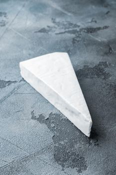 Delicious brie cheese, on gray background