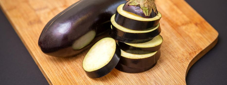 Eggplant on wooden cutting board