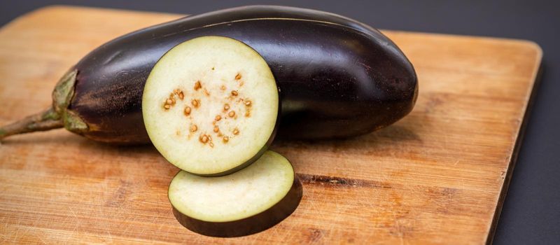 Eggplant on wooden cutting board