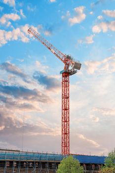 Tower crane on a dramatic sky background