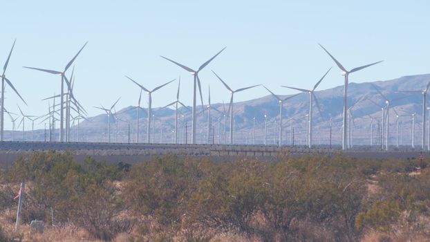 Windmills on wind farm, wind mill energy generators. Desert windfarm, USA.