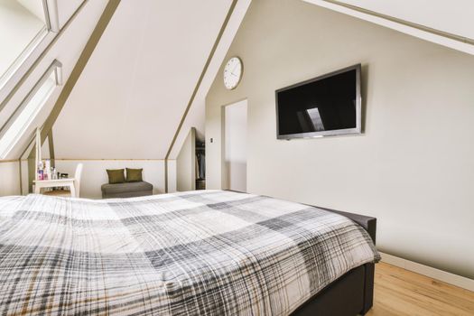 Mansard bedroom with minimalist interior design