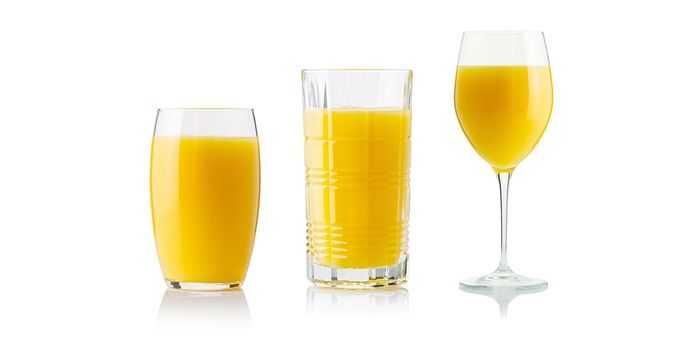 Collection of orange juice in different glasses . Separate clipping paths for each glass.