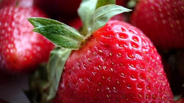 Macro composition of ripe garden red strawberries