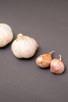 Two garlic heads and garlic cloves