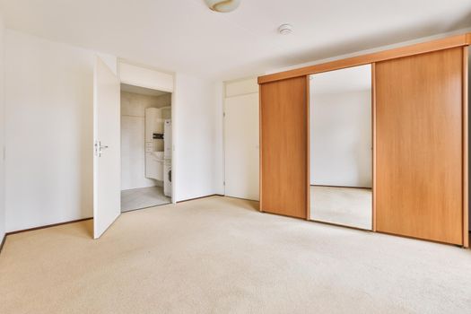 Interior of spacious room with storage furniture