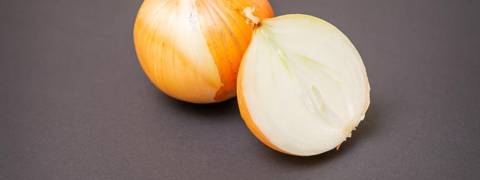 Whole and half raw yellow onions