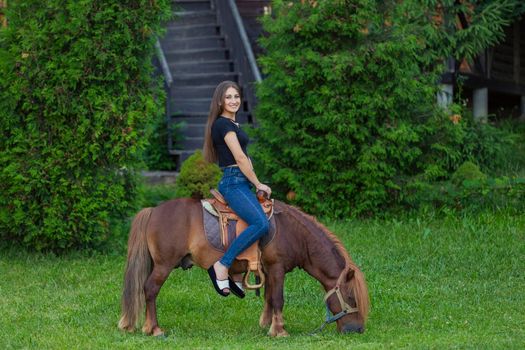 woman riding a pony