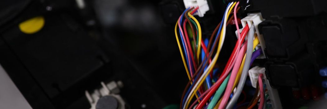 Large wide cable with multicolored wires and connectors in car