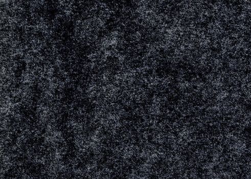 High detail magnified close up large image of rough uncoated black gray paper texture background scan grunge wallpaper pronounced fiber grain and particles distinguished black and white dirt pattern