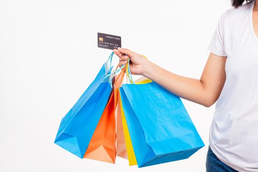 hand holding shopping bags multicolor and credit card