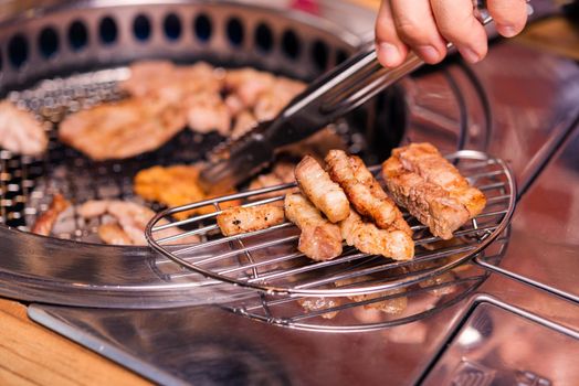 Grilling meat pork Korean BBQ traditional style on stove serve in restaurant