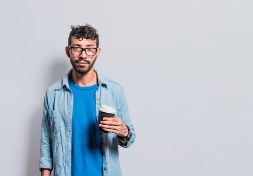Portrait of young man with paper cup of coffee, A person with paper cup of coffee in isolated background, people with paper cup of coffee isolated
