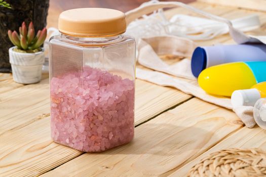 Pink quartz sage healing bath salt on wooden background