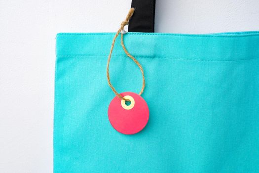 Eco bag for shopping with blank tag on white background