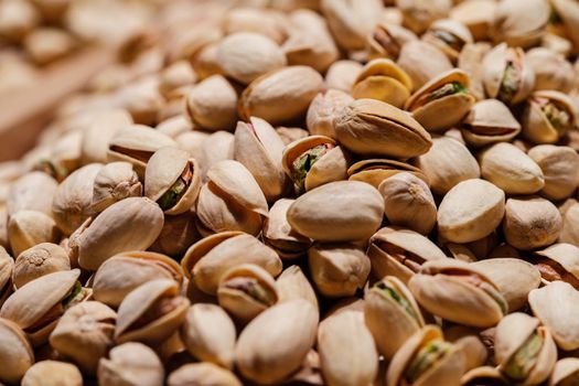Pistachios nuts texture and background, close up photo