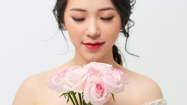 very nice sensual girl with bouquet of roses
