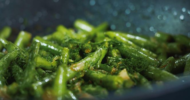 Cooked Green Beans Sprinkled with Dill . Close up Vegetarian Meals with Beans.