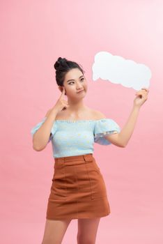 Young beautiful woman holding blank speech bubble with copy space for text. 