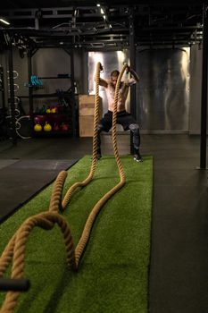 Rope warehouse fitness green man grass training gym muscular young, for strong strength from physical from healthy activity, person muscle. Cross ground holding,