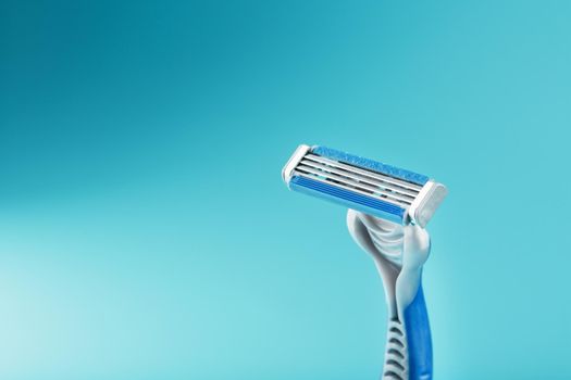 Blades of a new shaving machine on a blue background