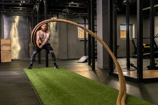 Rope warehouse fitness green man grass training gym muscular young, for strong strength from physical from healthy activity, person muscle. Cross ground holding,