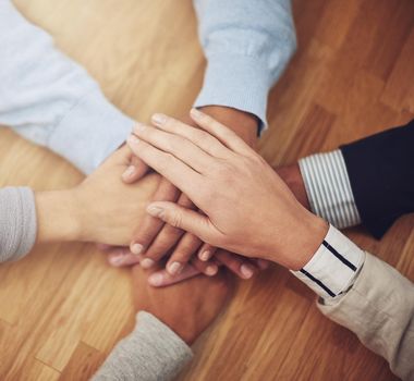 Hands down, the best team to have on the project. Cropped shot of a group of businesspeople putting their hands together in unity.