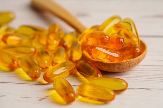 Fish oil or Cod liver oil gel in capsules with omega 3 vitamins, supplementary healthy food 